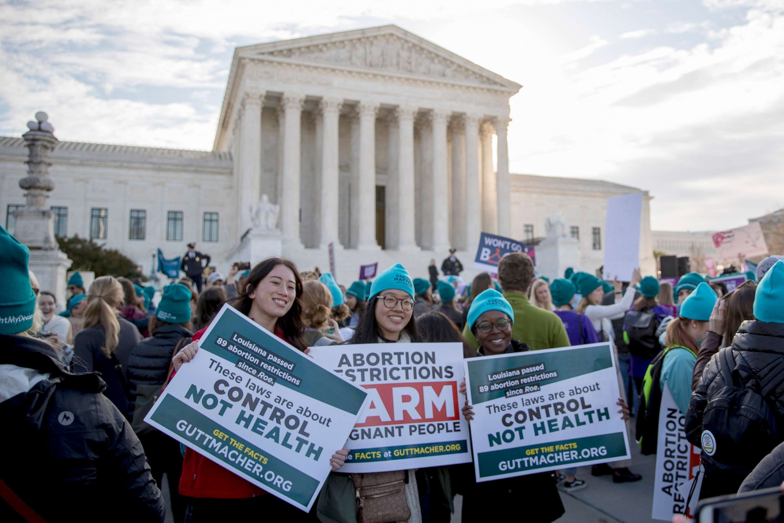 PHOTO: Abortion rights demonstrators pose for a photograph during a rally outside the Supreme Court, in Washington, D.C., March 4, 2020.
