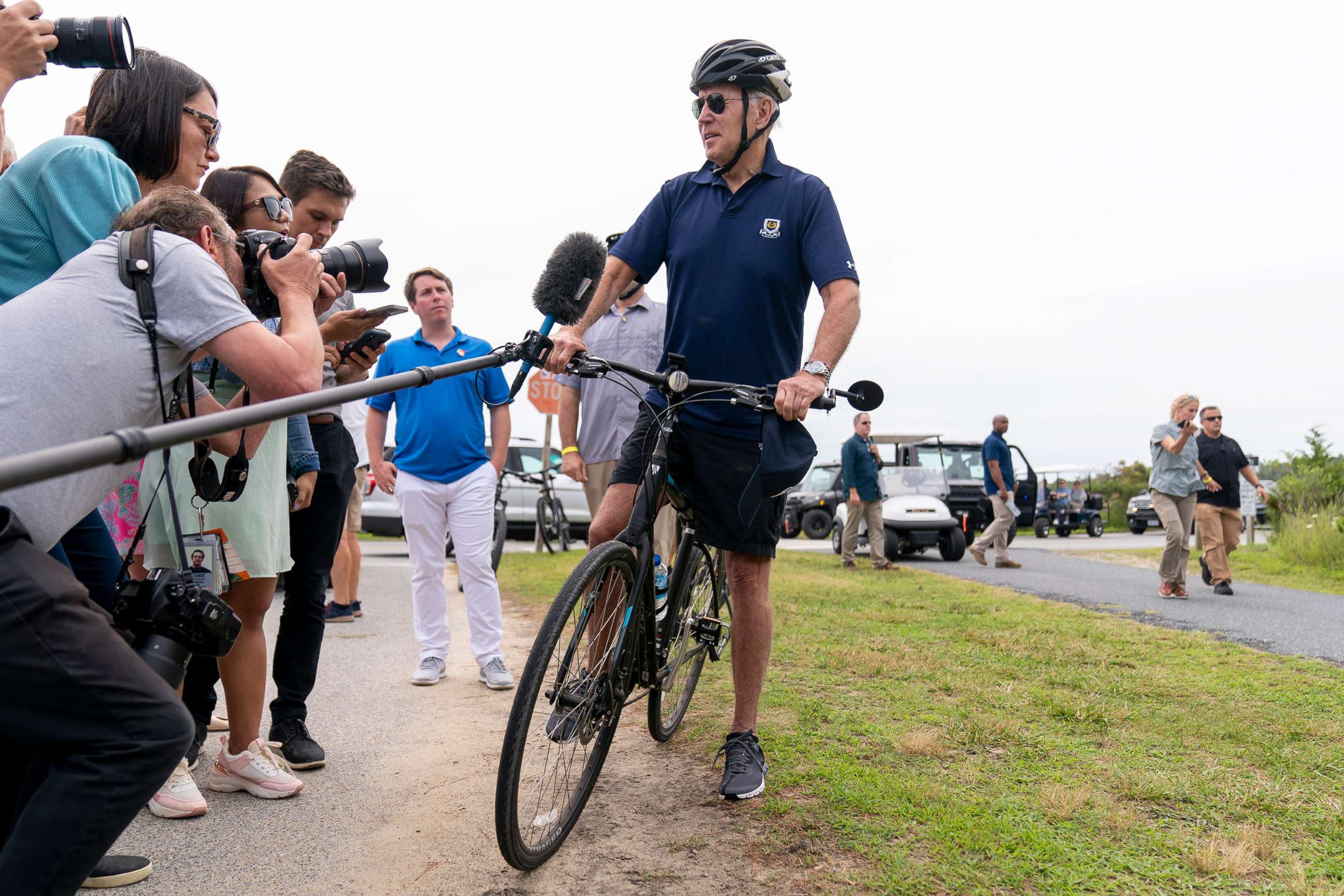 PHOTO: President Joe Biden speaks to members of the media as he goes on a bike ride in Gordons Pond State Park in Rehoboth Beach, Del., July 10, 2022. 