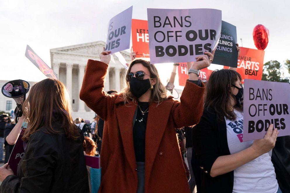 PHOTO: Emily Halvorson, center, of Washington, with Planned Parenthood, joins groups of abortion rights activists and anti-abortion activists as they rally outside the Supreme Court, Nov. 1, 2021, in Washington.