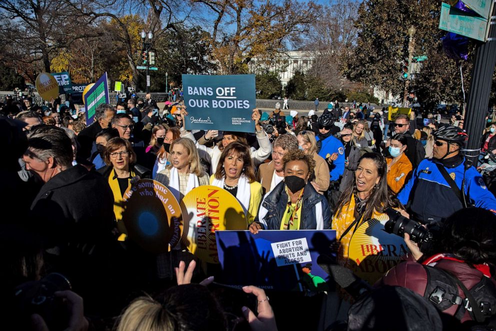 PHOTO: A group of Democratic members of Congress march to join the crowd at the Supreme Court in Washington, D.C. on Dec. 1, 2021, as arguments begin in the high-profile Mississippi abortion case of Dobbs v. Jackson Women's Health Organization.