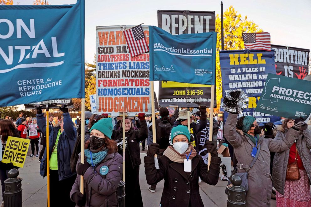 PHOTO: Protesters, demonstrators and activists gather in front of the U.S. Supreme Court as the justices hear arguments on a case about a Mississippi law that bans most abortions after 15 weeks, on Dec. 1, 2021 in Washington, D.C. 