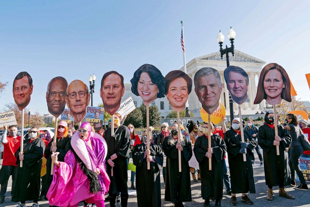 PHOTO: Abortion rights advocates holding cardboard cutouts of the Supreme Court Justices, demonstrate in front of the U.S. Supreme Court, Dec. 1, 2021, in Washington, D.C. 