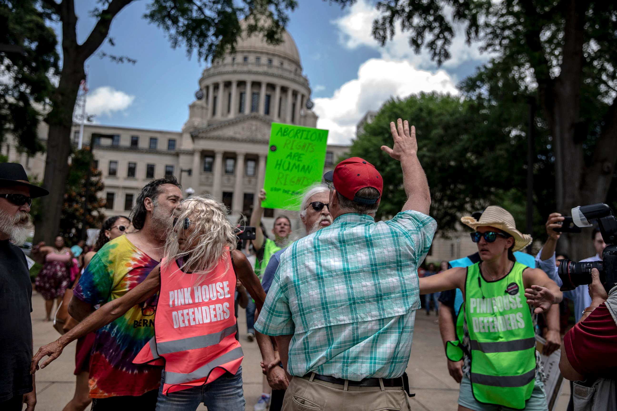 PHOTO: An abortion rights opponent wearing a red hat confronts a rally organized by Planned Parenthood Southeast against the abortion ban bills being legislated across the country, at the Mississippi State Capitol in Jackson, May 21, 2019. 
