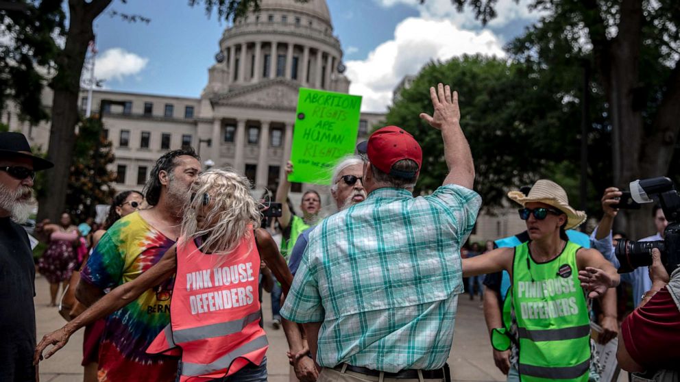 PHOTO: An abortion rights opponent wearing a red hat confronts a rally organized by Planned Parenthood Southeast against the abortion ban bills being legislated across the country, at the Mississippi State Capitol in Jackson, May 21, 2019. 