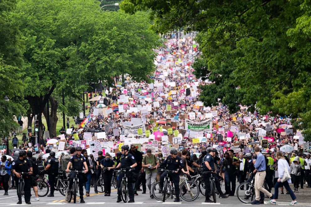 PHOTO: Demonstrators are seen on Constitution Avenue during a march for abortion rights in response to the Supreme Courts leaked draft opinion indicating the Court will overturn Roe v. Wade, May 14, 2022.