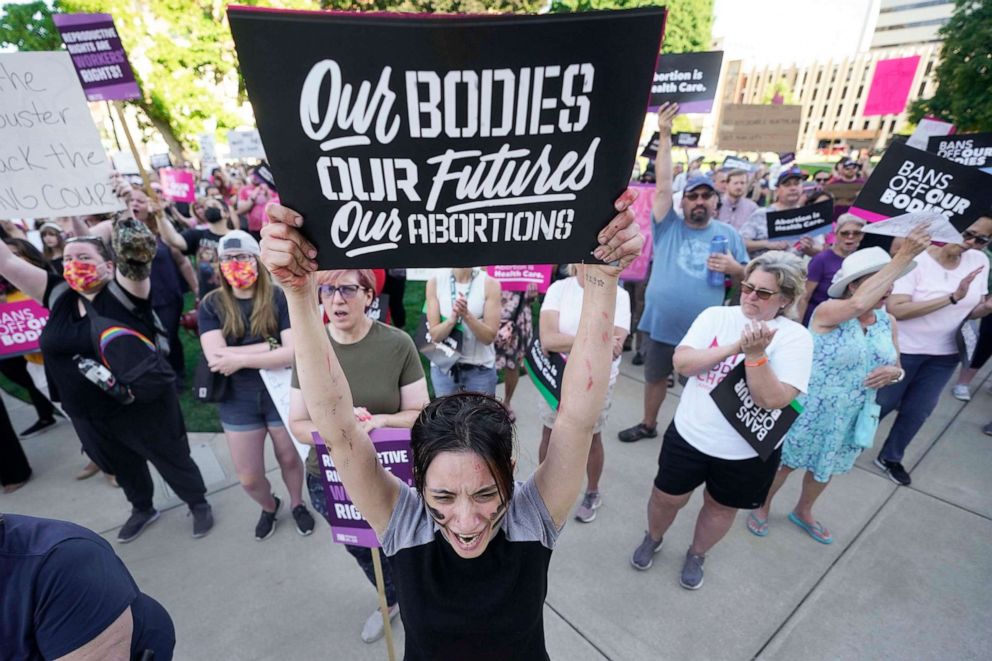 PHOTO: Abortion-rights protesters cheer at a rally following the United States Supreme Court's decision to overturn Roe v. Wade, federally protected right to abortion, outside the state capitol in Lansing, Mich., on June 24, 2022.