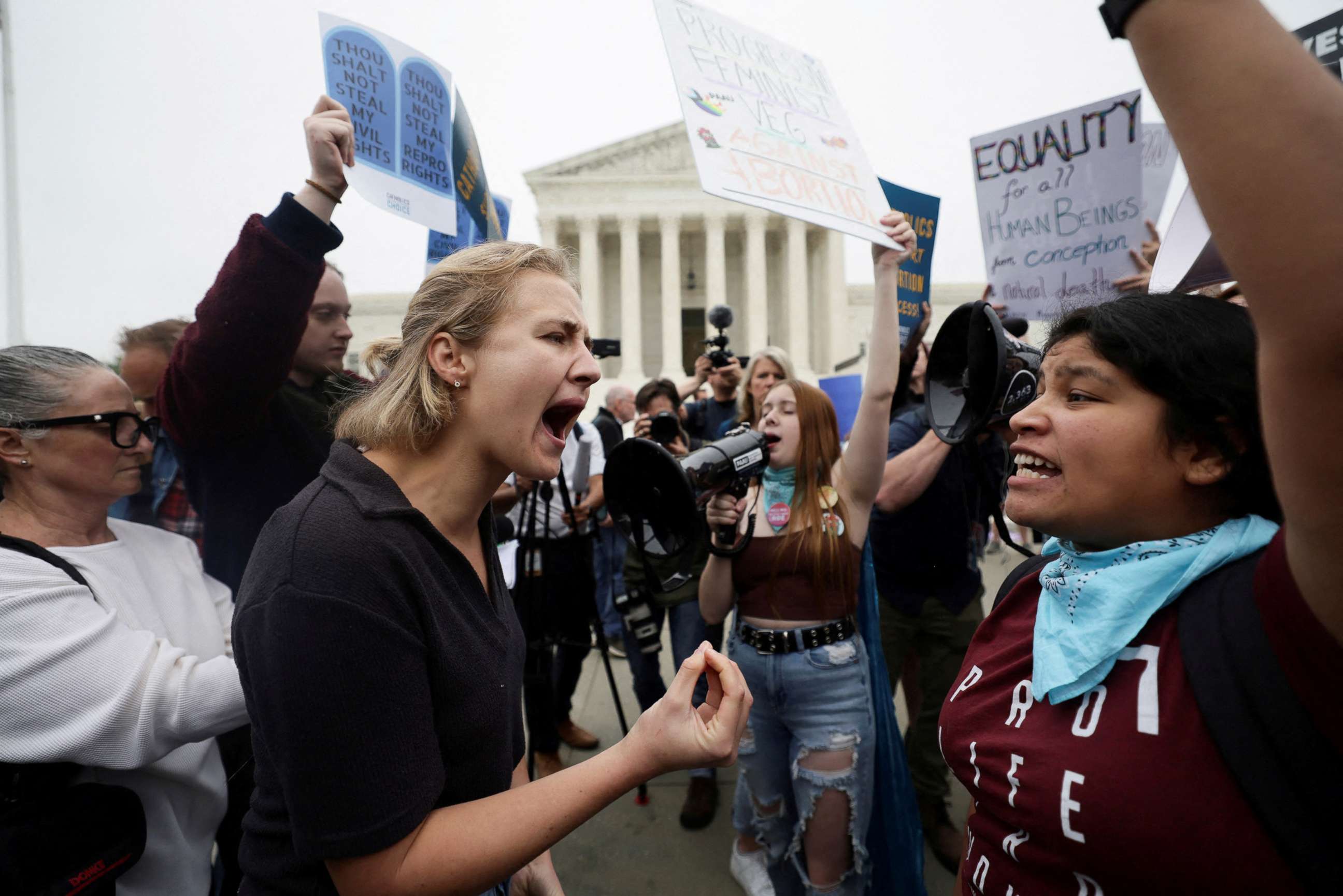 PHOTO: Pro-abortion and anti-abortion demonstrators protest outside the U.S. Supreme Court in Washington, May 3, 2022.