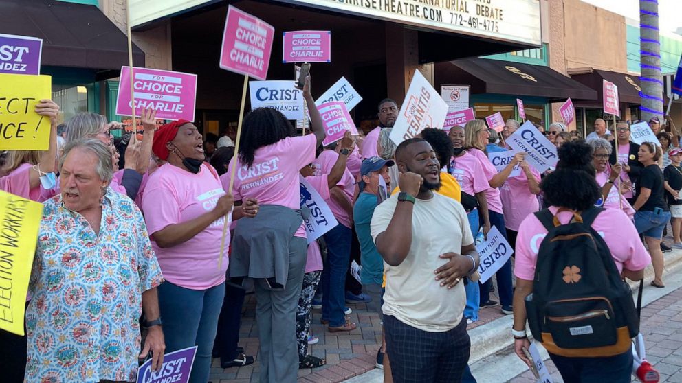 PHOTO: Rally attendees wearing shirts and displaying signs emphasizing abortion rights as an election issue before a televised debate in Fort Pierce, Fla., on Oct. 24, 2022.