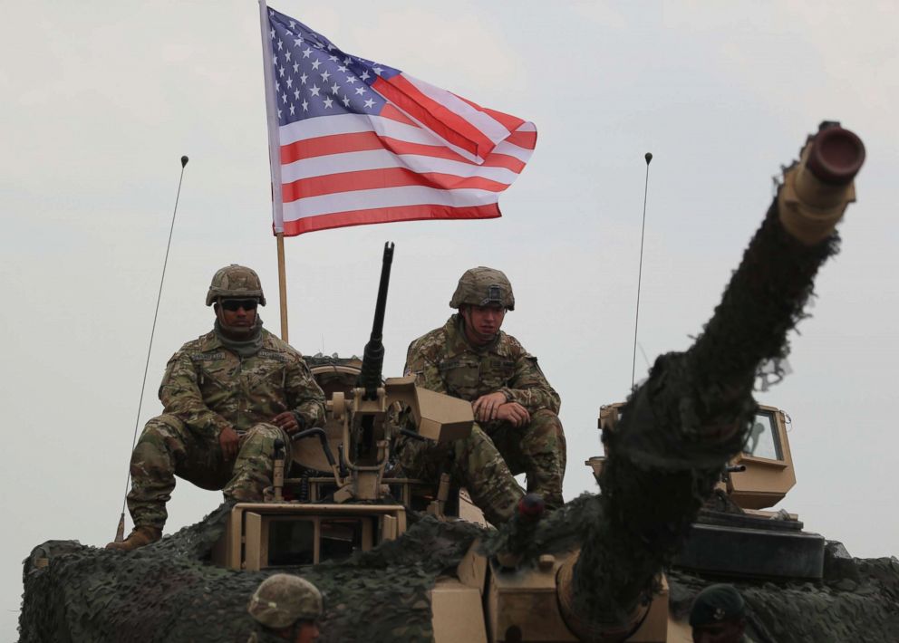 PHOTO: US servicemen sit on a M1A2 Abrams Main Battle Tank before the official opening ceremony of the joint multinational military exercise 'Noble Partner 2018' at the military base of Vaziani, outside Tbilisi, Georgia, Aug. 1, 2018. 