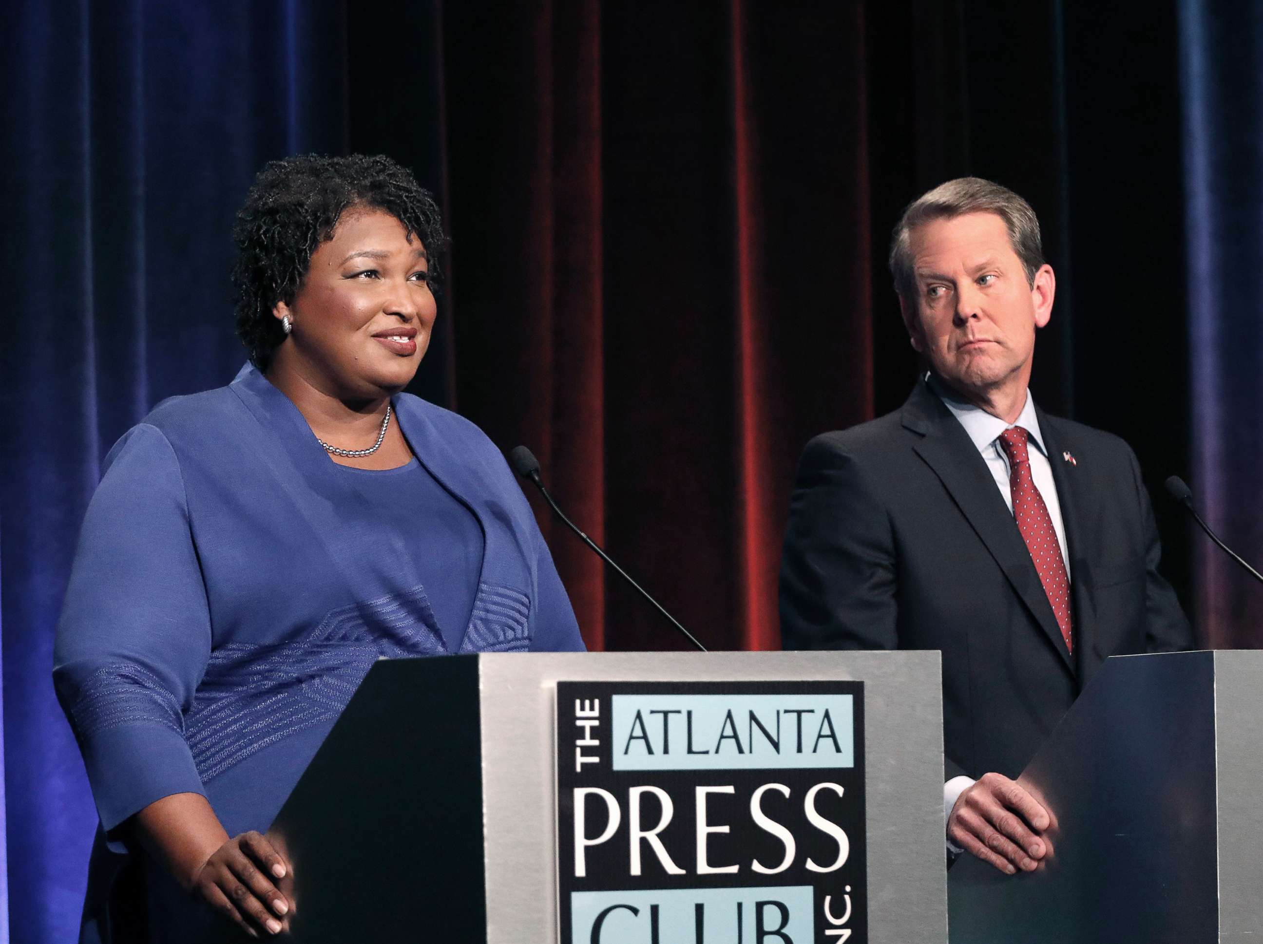 PHOTO: Democratic gubernatorial candidate for Georgia Stacey Abrams, left, speaks as her Republican opponent Secretary of State Brian Kemp listens during a debate in Atlanta, Oct. 23, 2018.