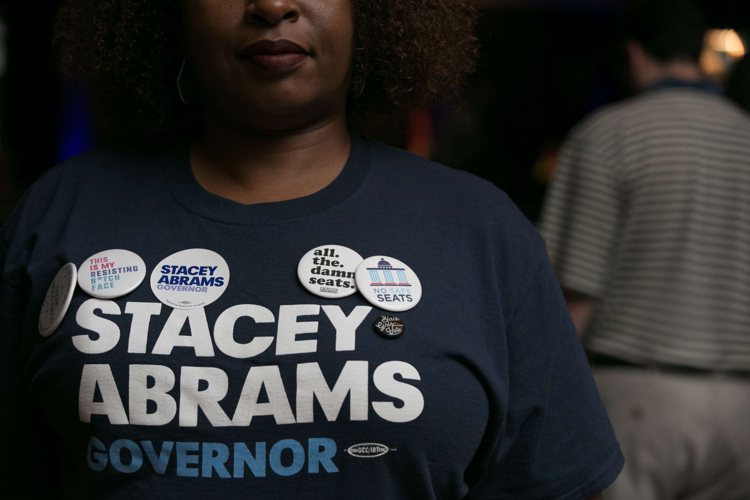 PHOTO: Supporter Nina Durham is adorned with political pins during the primary election night event for Georgia Democratic gubernatorial candidate Stacey Abrams, May 22, 2018, in Atlanta.