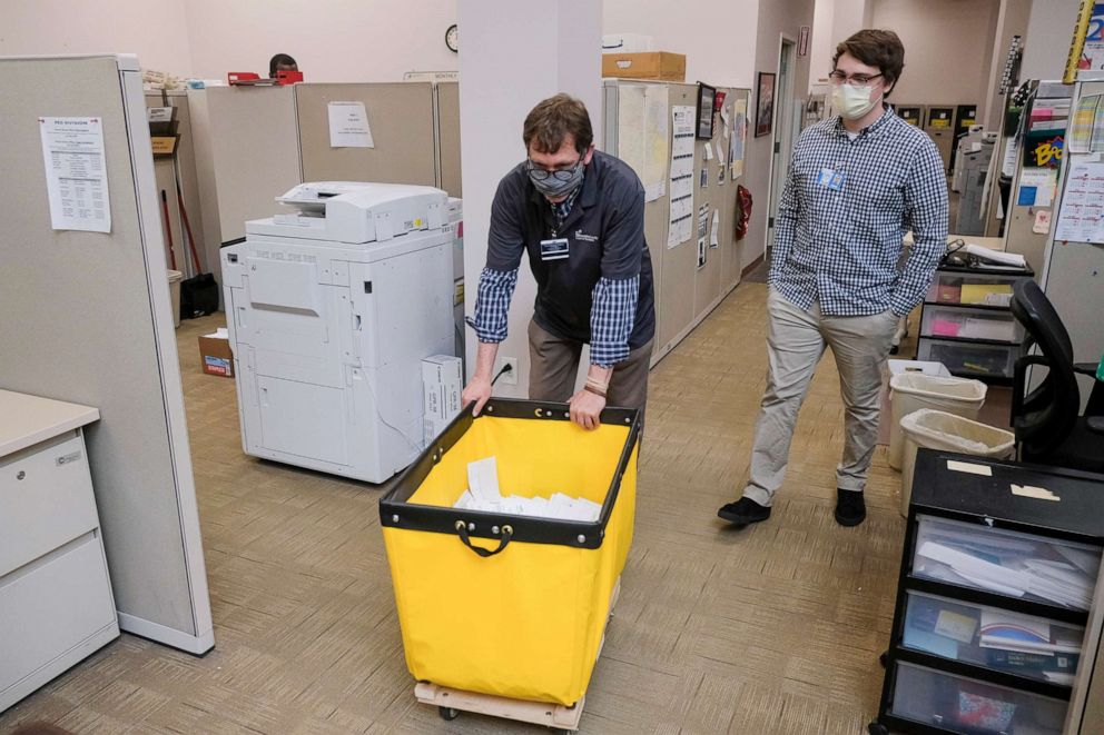 PHOTO: Employees and volunteers of the Franklin County Board of Elections sort through, and de-stub both mail in ballots and provisional ballots on April 28, 2020 in Columbus, Ohio on the final day of the the Primary Election.