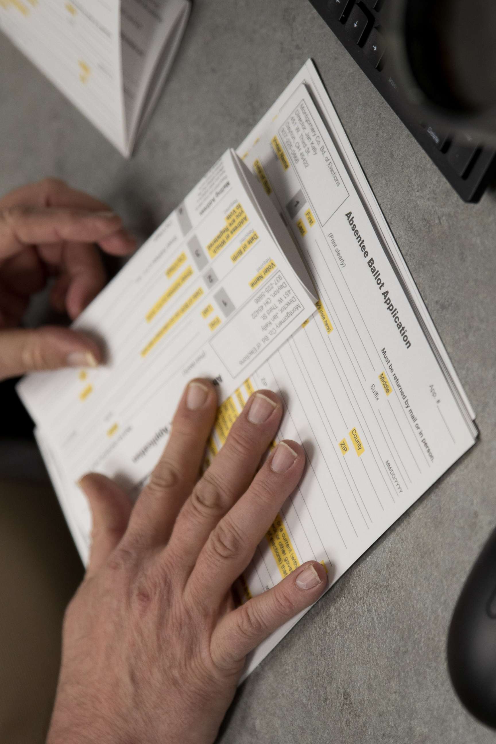 PHOTO: A county election worker prepares absentee ballots in Dayton, Ohio, March 17, 2020,  after the election was canceled. 