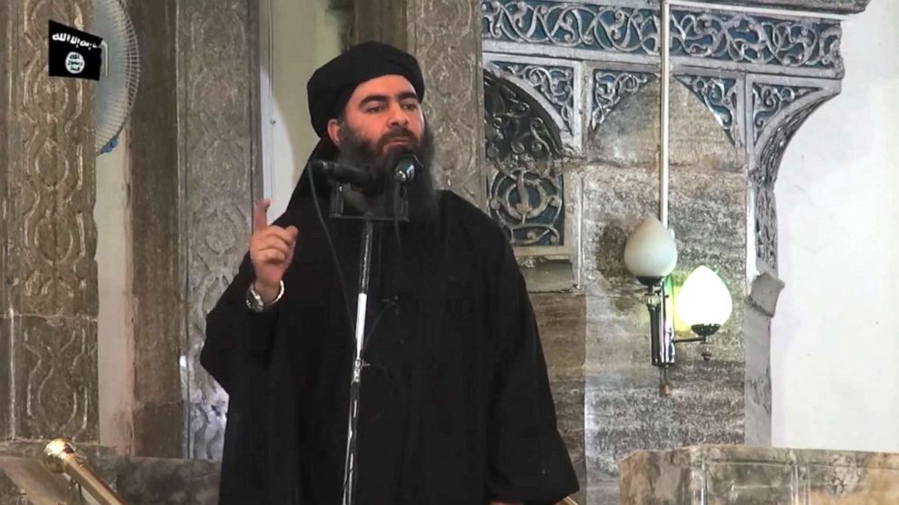 PHOTO: An image grab taken from a propaganda video released, July 5, 2014, by al-Furqan Media allegedly shows the leader of the Islamic State jihadist group, Abu Bakr al-Baghdadi, aka Caliph Ibrahim, adressing Muslim worshippers at a mosque in Mosul.