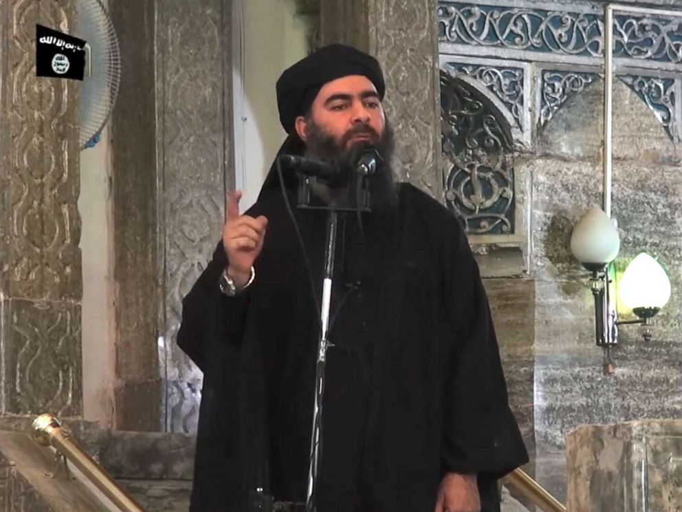 PHOTO: An image grab taken from a propaganda video released, July 5, 2014, by al-Furqan Media allegedly shows the leader of the Islamic State jihadist group, Abu Bakr al-Baghdadi, aka Caliph Ibrahim, adressing Muslim worshippers at a mosque in Mosul.