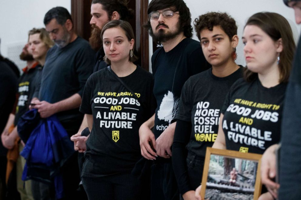 PHOTO: Activists with the Sunrise Movement protest at Senate Majority Leader Mitch McConnell's office in the Russell Senate building on Capitol Hill in Washington, DC, Feb. 25, 2019.
