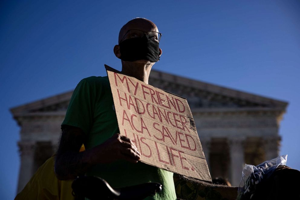 PHOTO: A supporter of the Affordable Care Act stands in front of the Supreme Court of the United States as the Court begins hearing arguments from California v. Texas about the legality of the ACA on Nov. 10, 2020, in Washington, D.C.