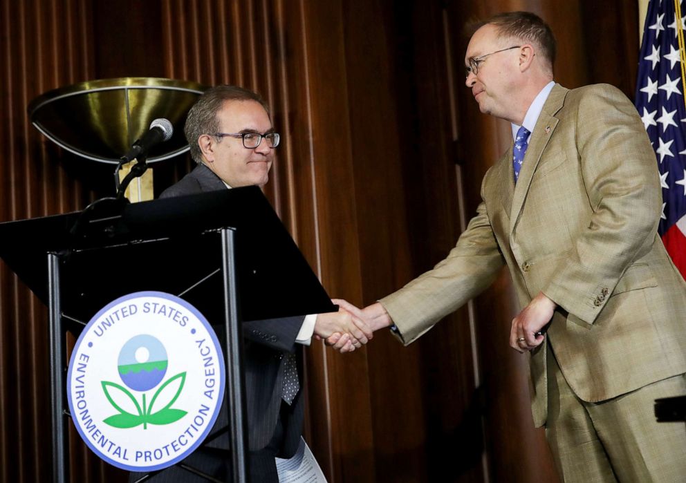 PHOTO: EPA  Administrator Scott Wheeler, left, shakes hands with acting White House Chief of Staff Mick Mulvaney after Wheeler signed the Affordable Clean Energy final rule at a ceremony at EPA headquarters, June 19, 2019 in Washington, D.C. 