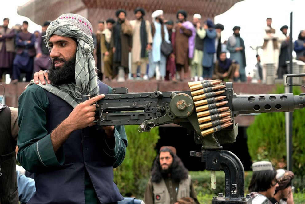 PHOTO: A Taliban fighter mans his weapon during celebrations one year after the Taliban seized the Afghan capital, Kabul, in front of the U.S. Embassy in Kabul, Afghanistan, Aug. 15, 2022.