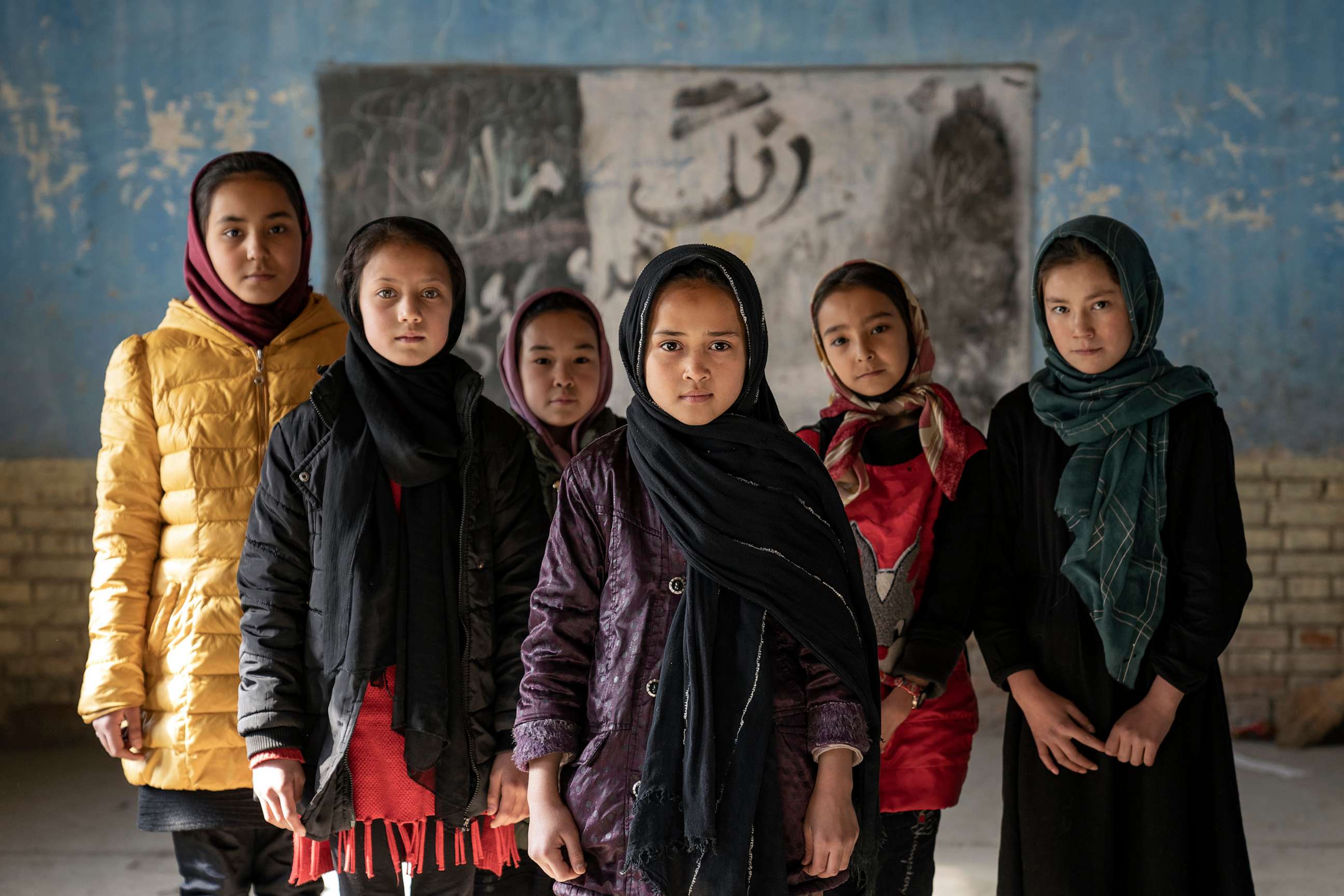PHOTO: Afghan schoolgirls pose for a photo in a classroom in Kabul, Afghanistan, on Dec. 22, 2022.
