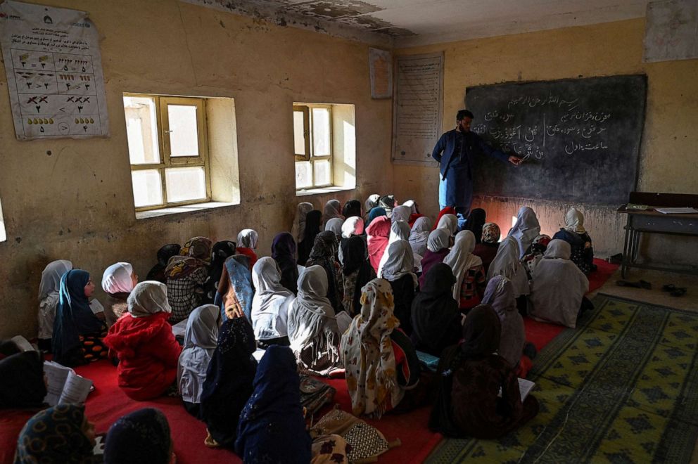 PHOTO: In this photograph taken on November 16, 2021, School girls attend class at a school in Arzo village on the outskirts of Ghazni in Afghanistan, Nov. 16, 2021.