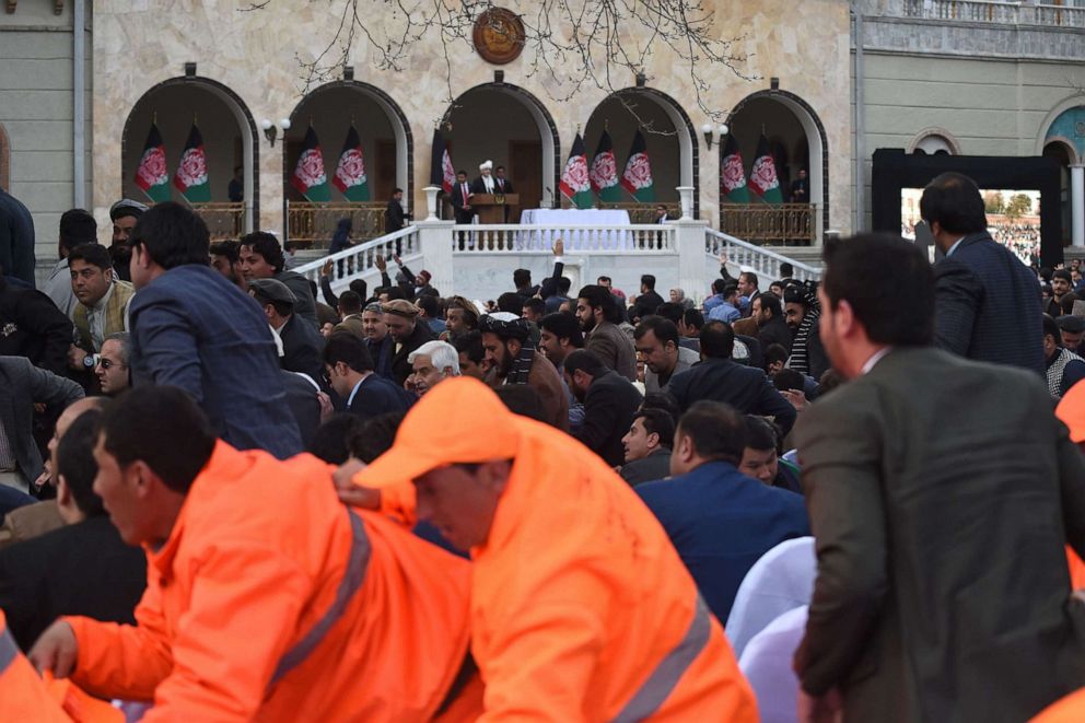 PHOTO: Officials and guests react after hearing loud blasts during Afghan President Ashraf Ghani's swearing in inauguration ceremony, at the Presidential Palace in Kabul on March 9, 2020.