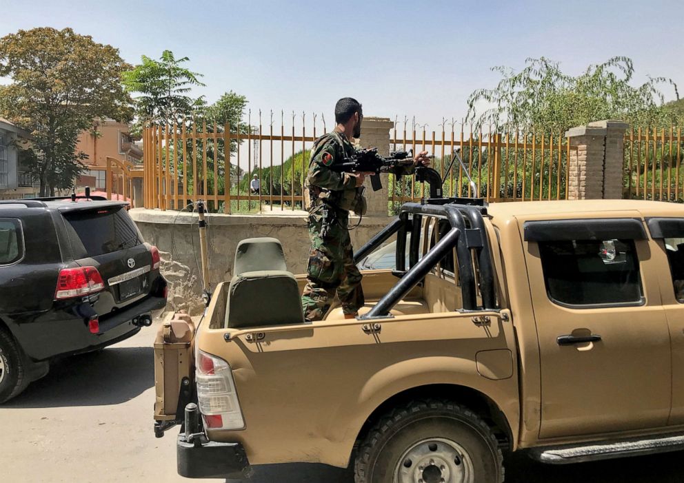 An Afghan soldier stands in a military vehicle on a street in Kabul, Afghanistan, August 15, 2021.