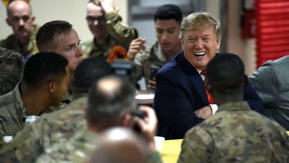PHOTO:President Donald Trump serves Thanksgiving dinner to US troops at Bagram Air Field during a surprise visit, Nov. 28, 2019, in Afghanistan. 