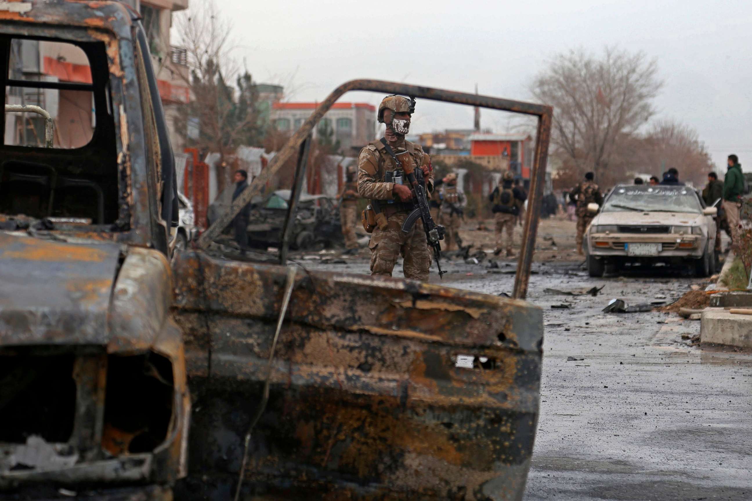 PHOTO: A member of Afghan security force stands guard at the site of an attack in Kabul on December 20, 2020. 