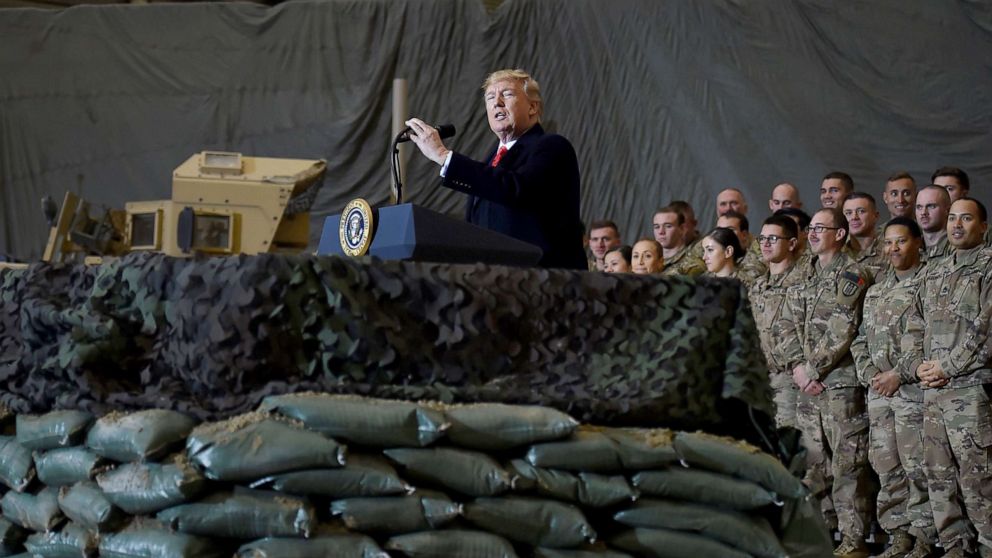 PHOTO: President Donald Trump speaks to the troops during a surprise Thanksgiving day visit at Bagram Air Field, Nov. 28, 2019, in Afghanistan. 