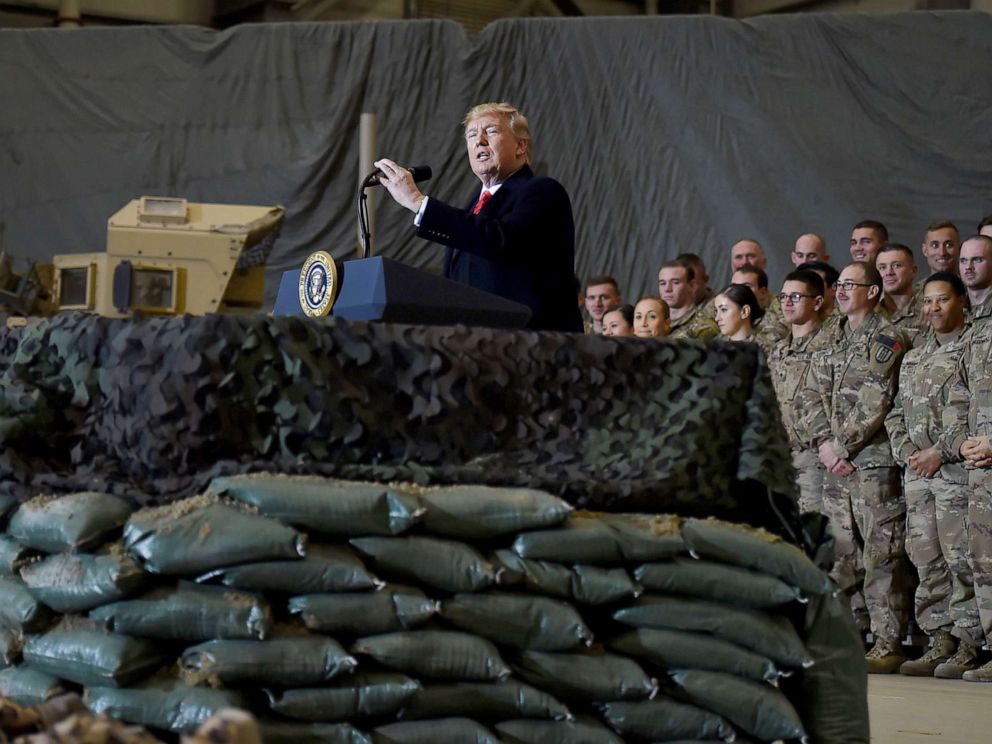 PHOTO: President Donald Trump speaks to the troops during a surprise Thanksgiving day visit at Bagram Air Field, Nov. 28, 2019, in Afghanistan. 