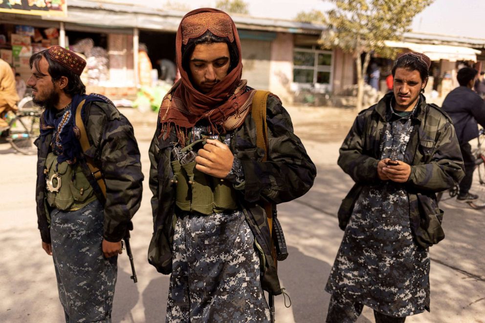 PHOTO: Taliban member Shafiullah, 19, (C), from Maidan Wardak Province, stands at a checkpoint in Kabul, Afghanistan, Oct. 22, 2021. 