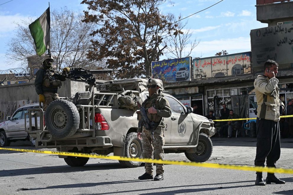 PHOTO: Security personnel stand guard near the site of multiple bomb blasts which killed at least two people, in Kabul, Feb. 10, 2021. 