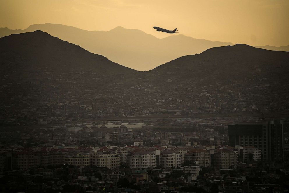 PHOTO: A plane takes off Hamid Karzai International airport in Kabul, Afghanistan.