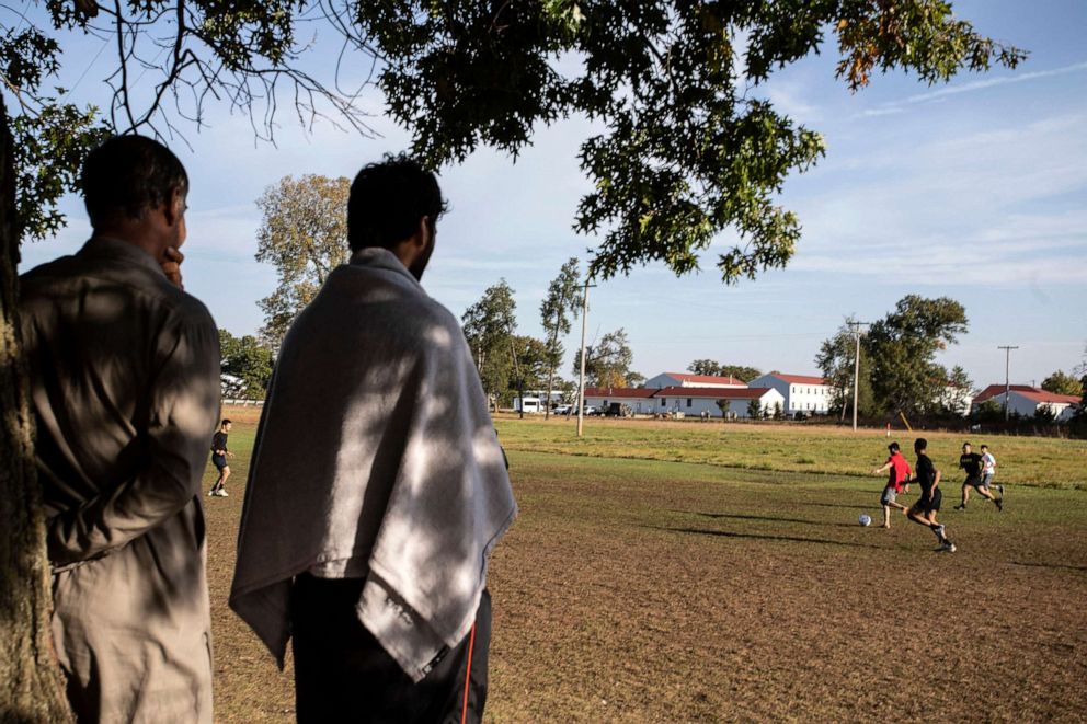 PHOTO: Members of the U.S. military and Afghan refugees play soccer at the Army base in Ft. McCoy, Wis., Sept. 30, 2021.