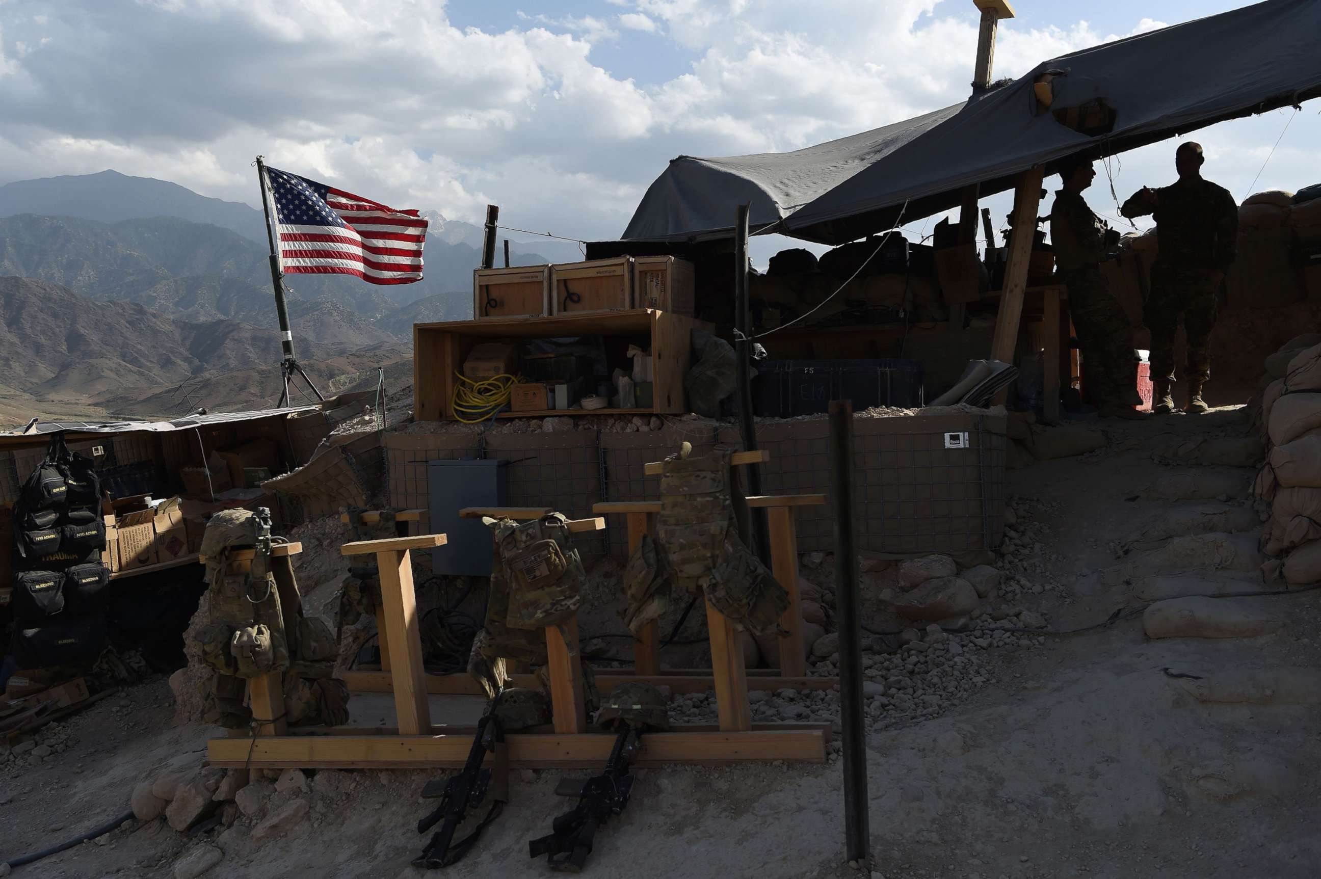 PHOTO: US Army soldiers from NATO look on as U.S. flag flies at a checkpoint during a patrol against Islamic State militants at the Deh Bala district in the eastern province of Nangarhar Province, Afghanistan, July 7, 2018.