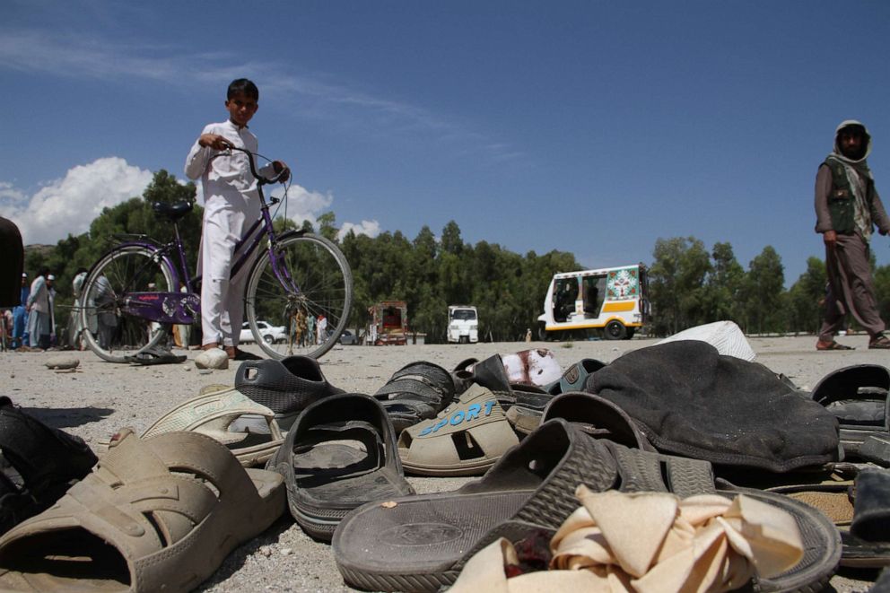 PHOTO: People gather at the scene of a bomb blast that targeted the funeral of a local police commander on the outskirts of Jalalabad, Afghanistan, May 12, 2020.