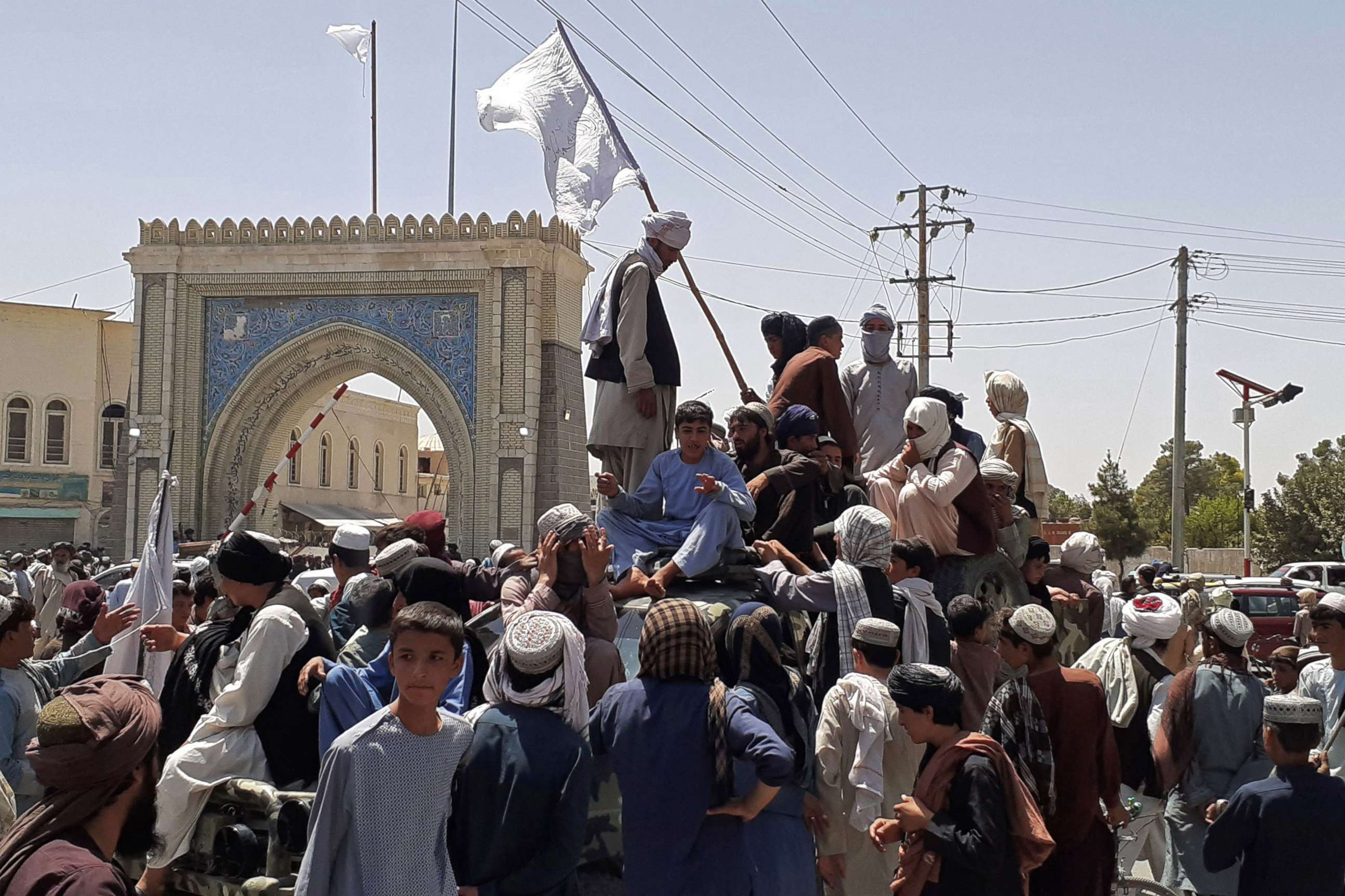 PHOTO: Taliban fighters stand on a vehicle along the roadside in Kandahar on Aug. 13, 2021.