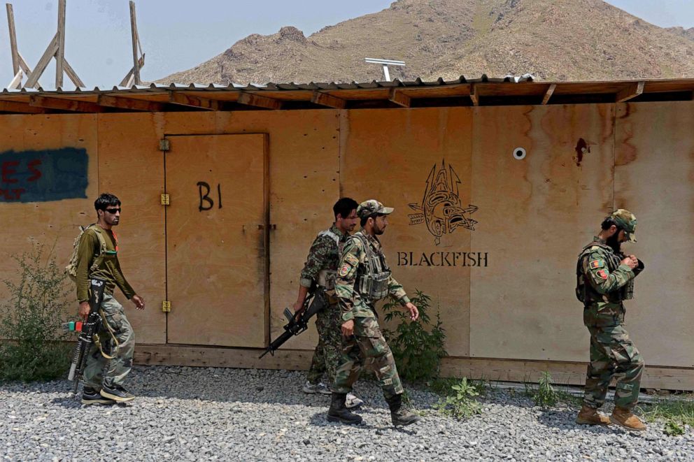PHOTO: In this July 26, 2020, file photo, Afghan National Army (ANA) soldiers walk in a US military base, which has been recently handed over to Afghan forces in Achin district of Nangarhar province.