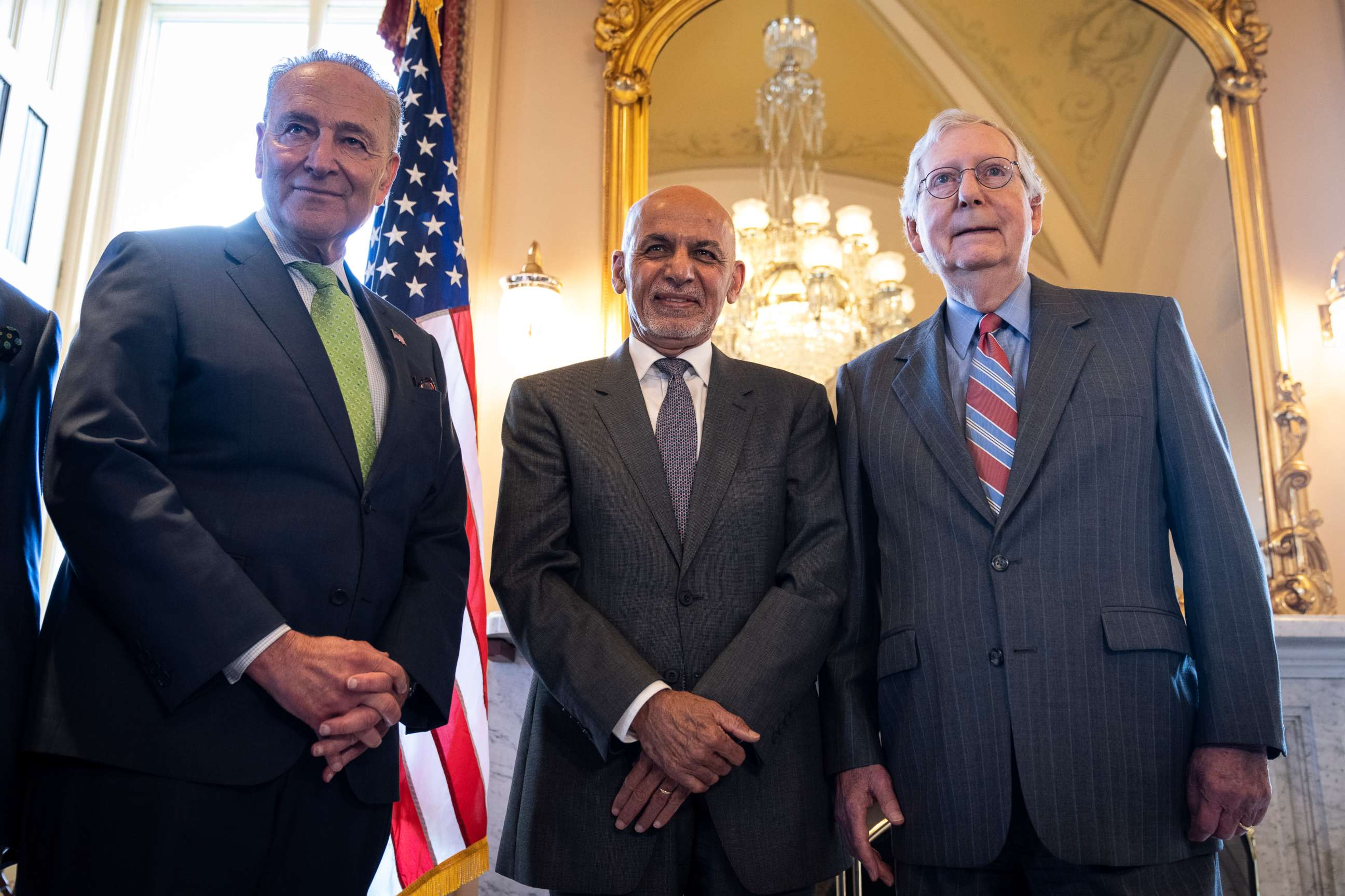 PHOTO: Senate Majority Leader Chuck Schumer, President of Afghanistan Ashraf Ghani and Senate Minority Leader Mitch McConnell pose for pictures before a meeting at the U.S. Capitol on June 24, 2021, in Washington.