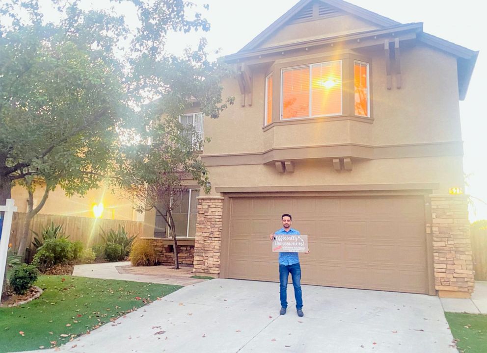 PHOTO: Prince Wafa poses in front of his house in San Diego after purchasing it on Nov. 9, 2020.