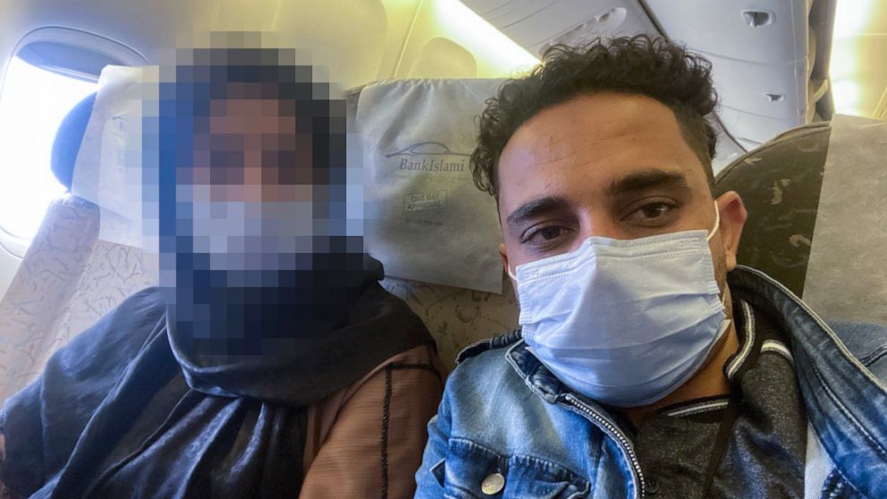PHOTO: Prince Wafa and his wife take a selfie on a Qatar Airways flight from Kabul, Afghanistan, to Doha, Qatar, on Oct. 22, 2021.