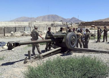 PHOTO: U.S. military advisers work with Afghan soldiers at an artillery position on an Afghan National Army base in Maidan Wardak province, Afghanistan, Aug. 6, 2018.