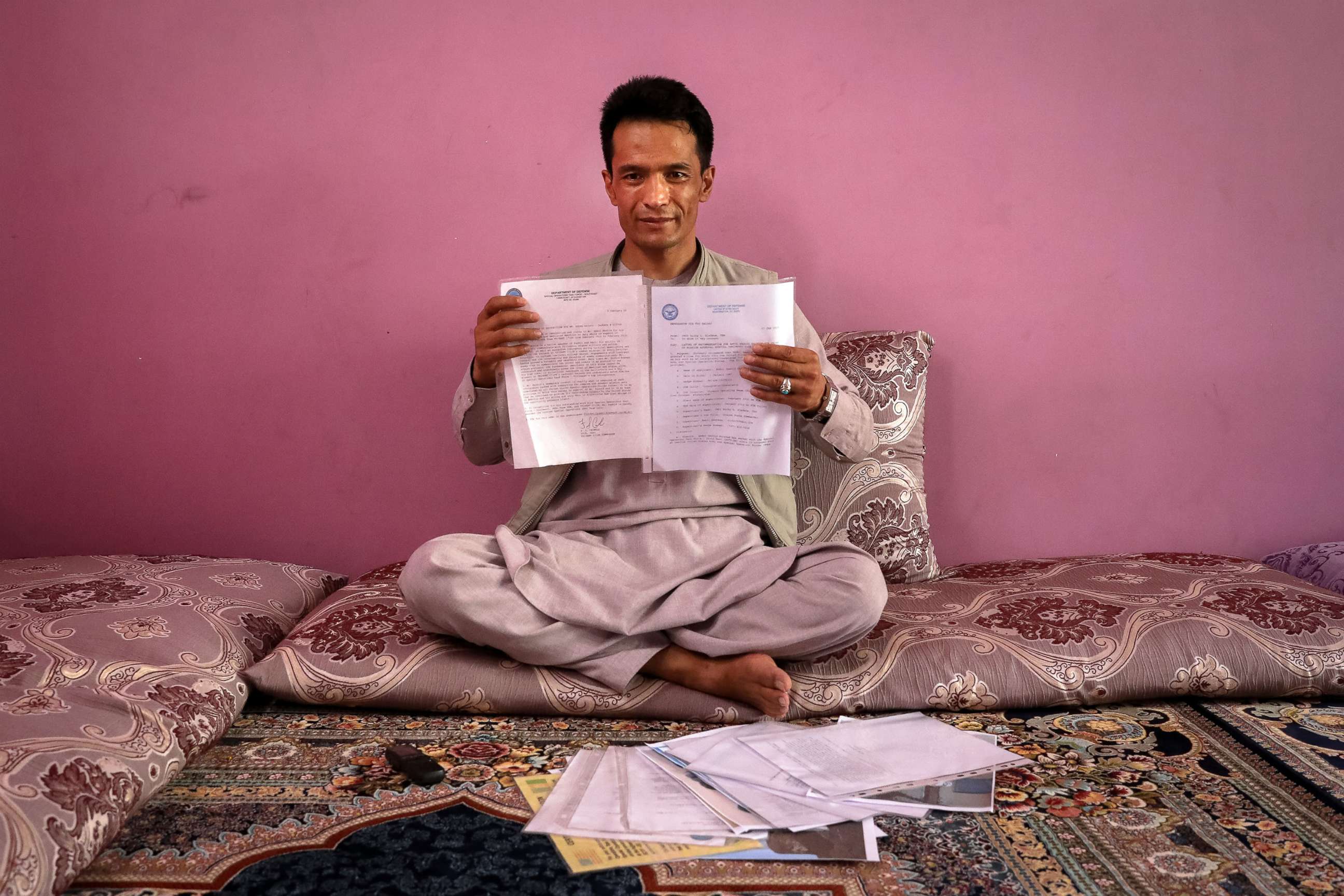 PHOTO: Afghan former interpreter for US forces, Abdul Rashid Shirzad poses for a photograph as he is showing his documents during an interview with EFE at his house in Kabul, Afghanistan, June 22, 2021.
