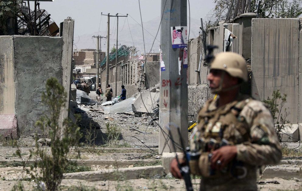 PHOTO: An Afghan security personnel stands guard at the site where a Taliban car bomb detonated at the entrance of a police station in Kabul on Aug. 7, 2019.