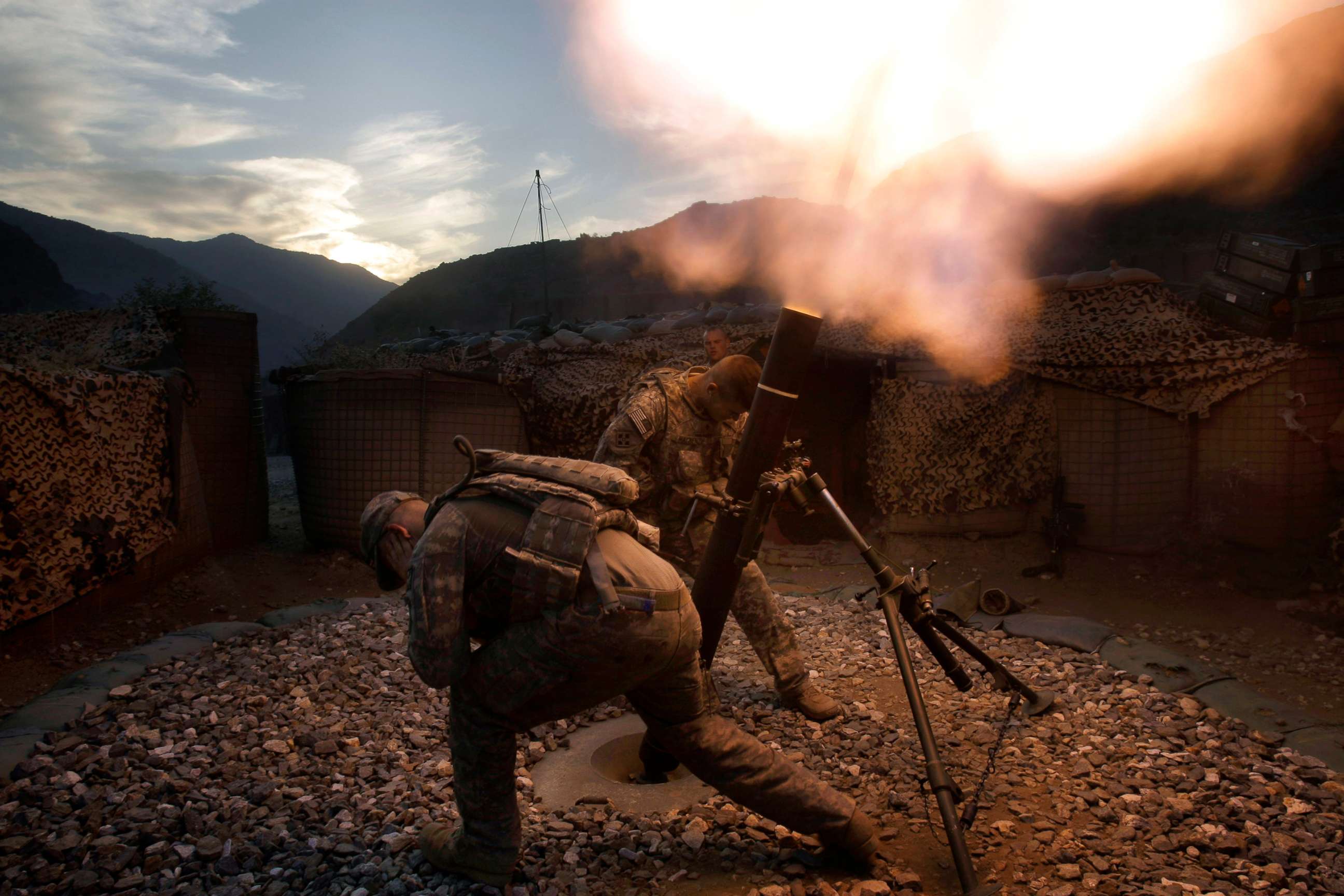 PHOTO: U.S. soldiers from the 2nd Battalion, 12th Infantry Regiment, 4th Brigade Combat Team, 4th Infantry Division fire mortars in the Pech Valley of Afghanistan's Kunar province, Oct. 26, 2009.