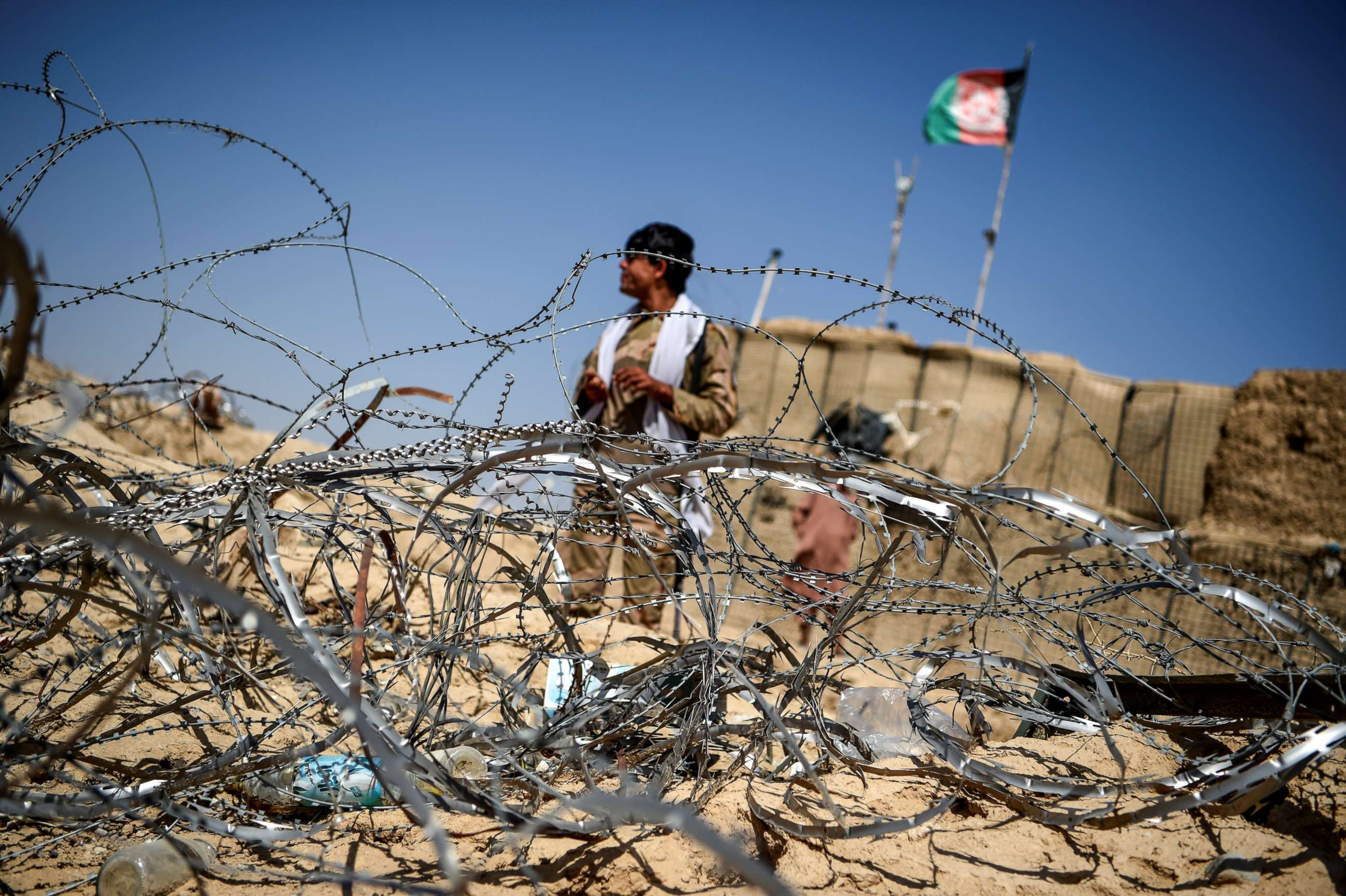 PHOTO: A policeman keeps watch as he stands outside an outpost set up against Taliban fighters at Aziz Abad village in Maiwand district of Kandahar province of Afghanistan, Sept. 27, 2020.