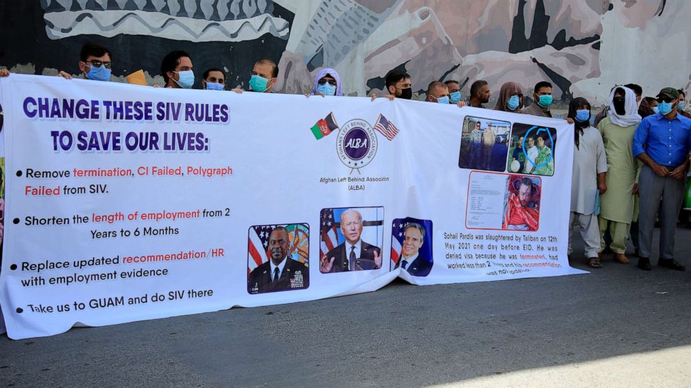 PHOTO: In this June 25, 2021 photo, former Afghan interpreters hold placards during a demonstrations against the US government, in front of the US Embassy in Kabul, Afghanistan.