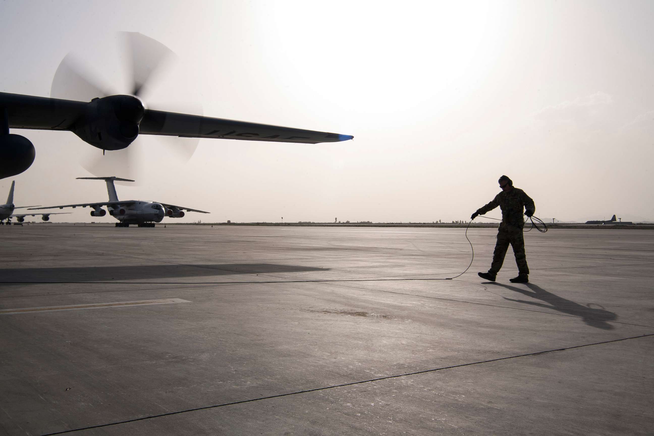 PHOTO: U.S. Air Force Tech. Sgt. Brian Porter, a 746th Expeditionary Airlift Squadron loadmaster, finishes an engine startup at Kandahar Air Base, Afghanistan, April 28, 2020. 