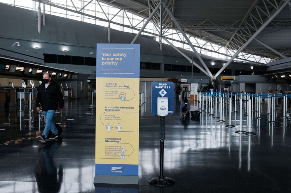 PHOTO: People walk through a nearly empty  international terminal at John F. Kennedy Airport (JFK), Jan. 25, 2021, in New York City.